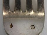 a fork that has a hole in the middle of it