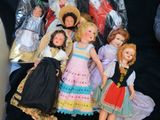 a black shirt with a bunch of dolls on it