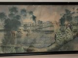 une image d'un tableau sur le mur d'une pièce