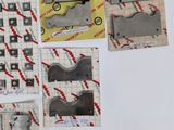 many pieces of metal that are on a piece of paper