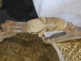 a glove sitting on the arm of a chair
