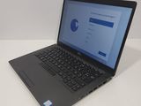 a laptop computer that is sitting on a table
