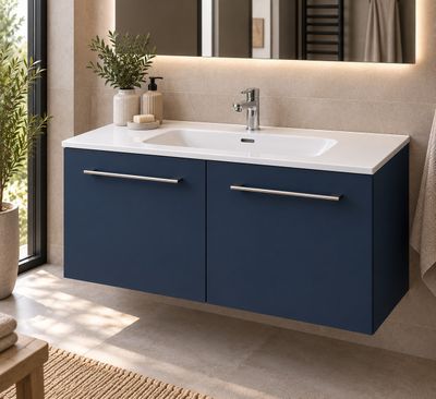 a bathroom with a sink and a mirror in it