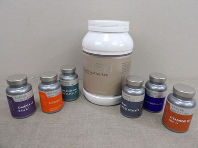 six bottles of vitamins and one jar of vitamin