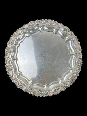 an image of a silver plate on a black background