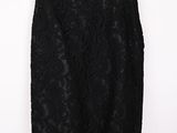 a black lace skirt hanging on a hanger on a white wall