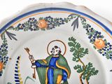 a plate with a picture of a man holding a guitar