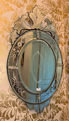 a mirror hanging on the wall in a bathroom