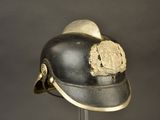 a black helmet with a gold emblem on it