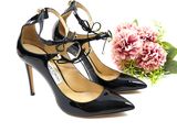 pair of black high heeled shoes and a bouquet of flowers