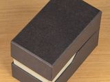 a black box that has two books inside of it