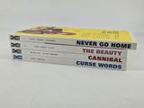 three books are stacked on top of each other on a white surface