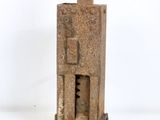an old rusted metal device on a white surface with a white background