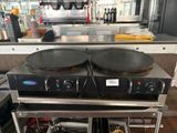 two pans sitting on top of a stove in a kitchen