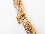an image of a close up of a bracelet with a gold clasp