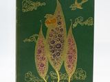 a green book with a picture of a bird on top of it