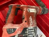 a red tool in a red box with a hammer in it