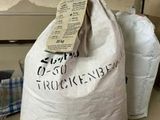 a bag of rice sitting on a counter next to a bowl