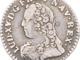 a close up of a coin on a white background