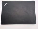 a black mouse pad on a white surface with a black mouse pad