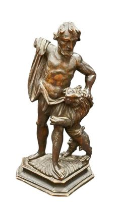 statue en bronze représentant un homme avec un chien, posée sur un socle