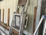 a ladder leaning against a wall next to a building
