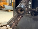 a close up of a fork on a pallet in a warehouse