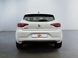 the rear end of a white car in a white room