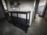 a black table with a mirror on top of it in a room