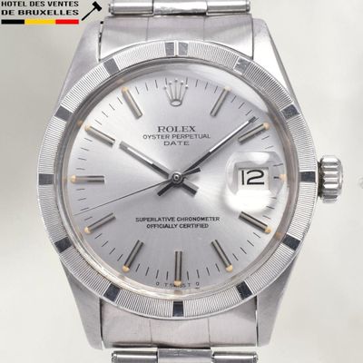 an image of a silver rolex watch with a white dial