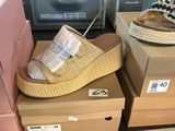 several boxes of shoes are stacked on top of each other in a store