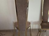 two chairs that are next to each other on the floor