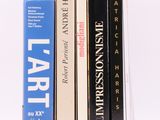 three books that are sitting on top of each other