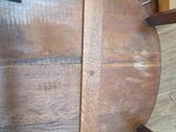 a wooden chair that is sitting on a hard wood floor