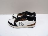 leopard print sneakers with black and white soles on a white surface