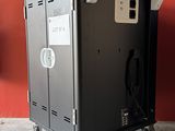 a black metal cabinet with a power outlet on wheels