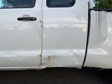 a white truck that is parked in the parking lot
