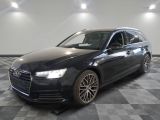 une image d'une audi wagon noire garée dans un garage