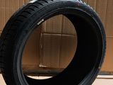 tire on cardboard box next to cardboard box and cardboard box