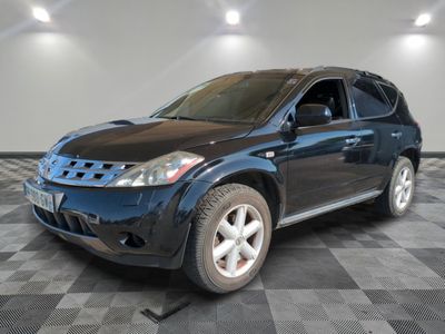 a picture of a blue suv parked in a garage