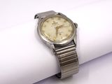 an image of a wrist watch sitting on top of a napkin