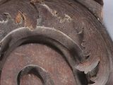 a close up of a decorative object on a white surface