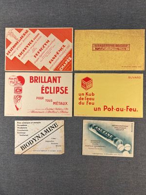 several different business cards are displayed on a gray surface