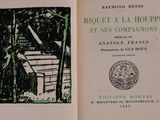 an open book with a picture of a house in it