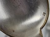 a spoon that has some kind of metal on it