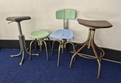 three stools sitting next to each other in a room