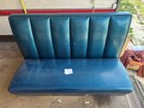 a blue bench that is sitting in the garage