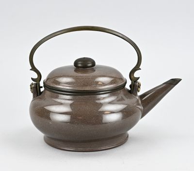 a brown teapot with a handle on a white surface
