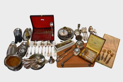 many different types of silverware and silverware on display