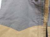 the back of a man ' s jacket with a pocket on it